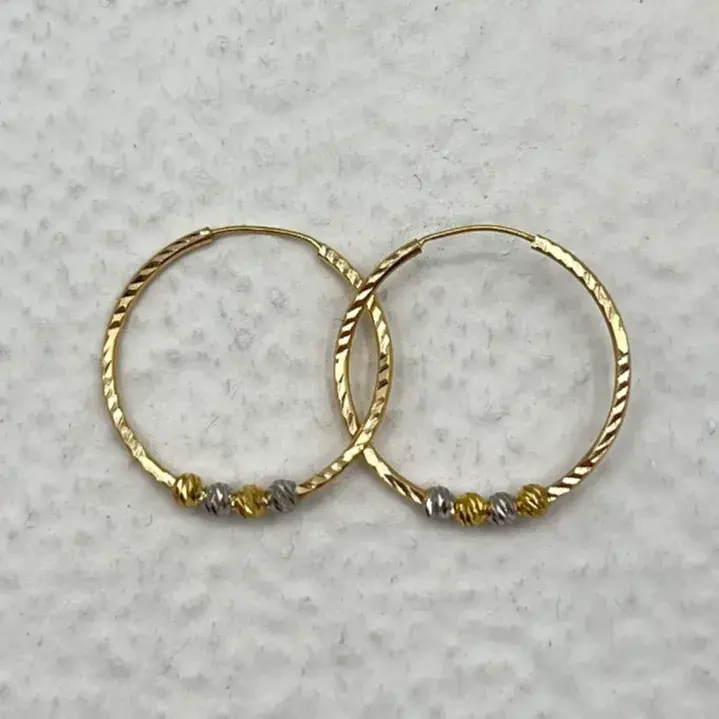 گوشواره طلا 18 عیار مدل حلقه‌ای تراش چهار گوی البرنادو وزن 1.500 گرم 2